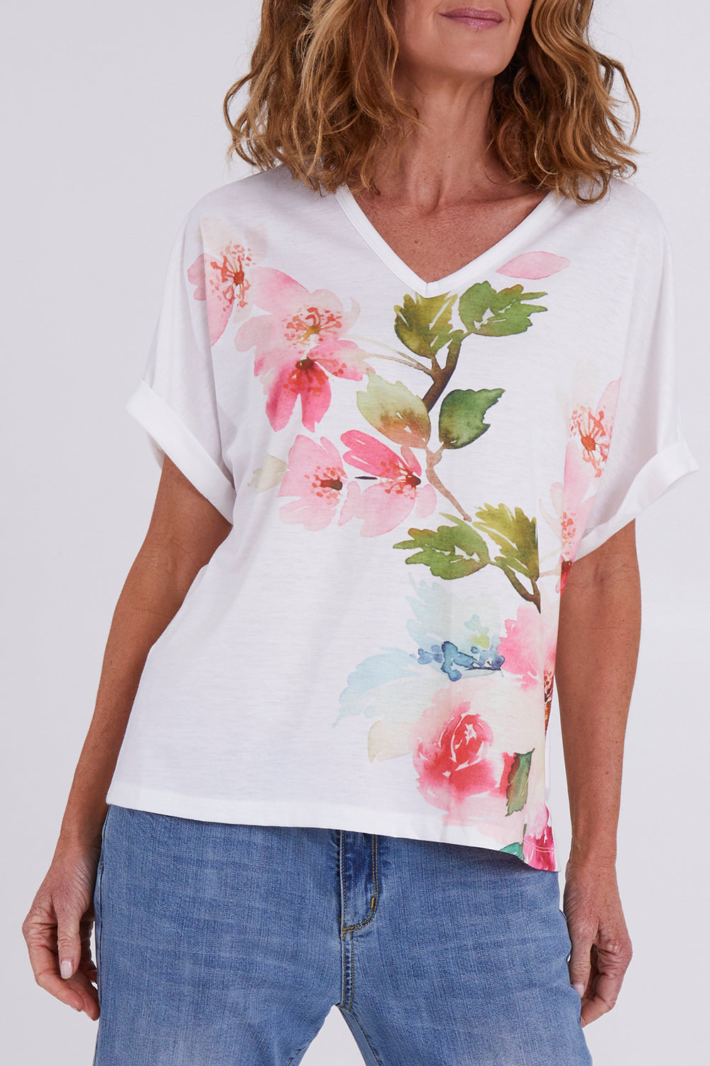 Model Emma wearing size 10 of the Floral Bouquet Tee in colour White (White), from the front, cropped image