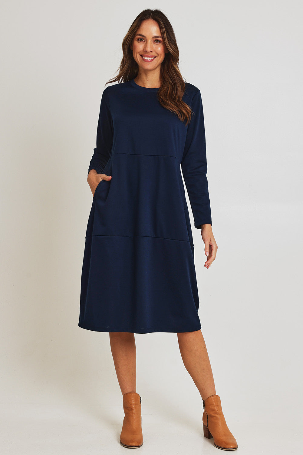 Model Madeline wearing size 10 of the Core Pocket Dress in colour Navy (Blue), from the front, showing the whole outfit