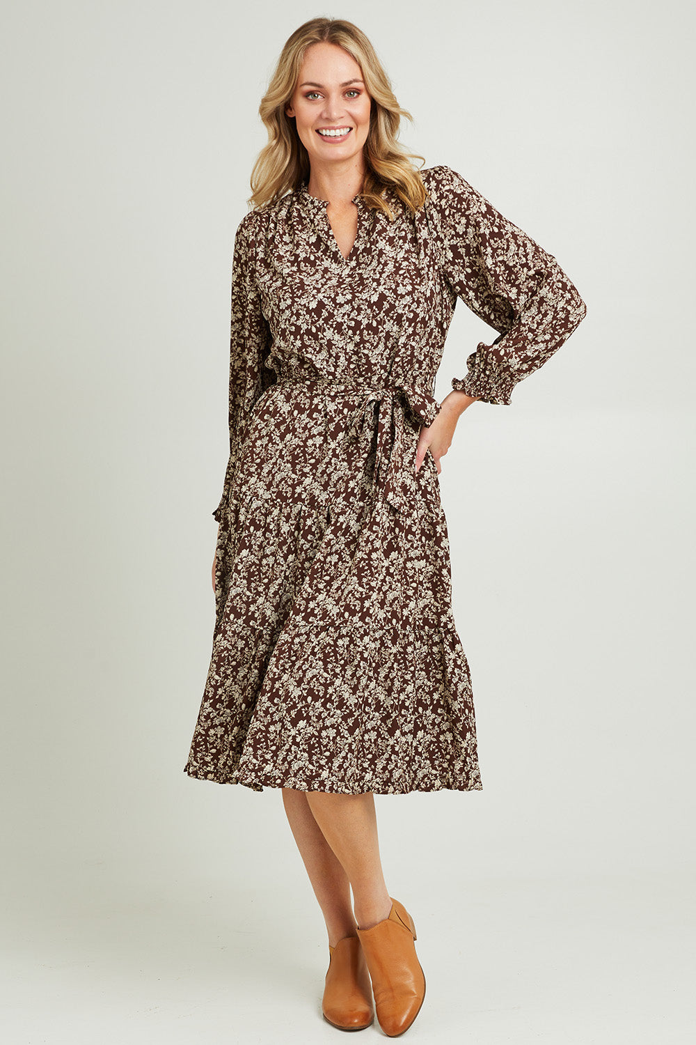Model Grace wearing size 10 of the Felicia Dress in colour Mocha, from the front, showing the whole outfit