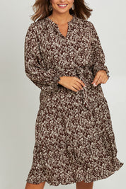 Model Monique wearing size 14 of the Felicia Dress in colour Mocha, from the front, cropped image