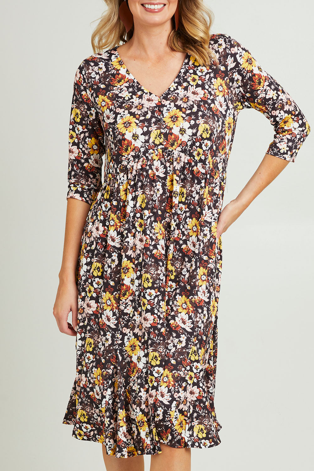 Model Grace wearing size 10 of the Jessie L/S Dress in colour Black (Black), from the front, cropped image