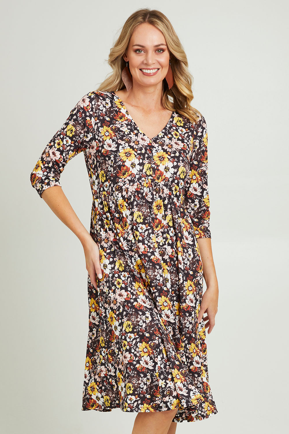 Model Grace wearing size 10 of the Jessie L/S Dress in colour Black (Black), from the front, cropped image