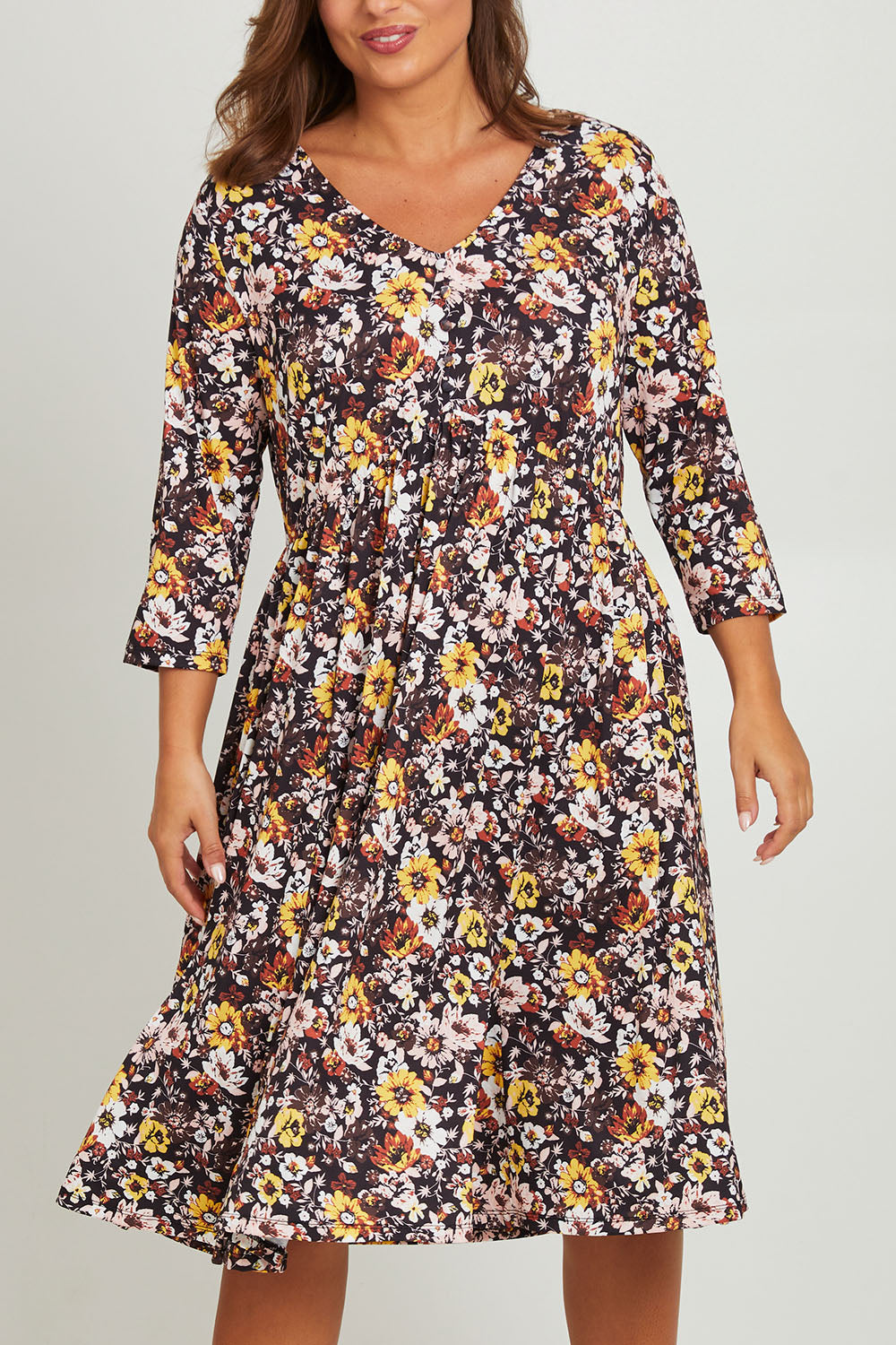 Model Monique wearing size 14 of the Jessie L/S Dress in colour Black (Black), from the front, cropped image