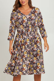 Model Monique wearing size 14 of the Jessie L/S Dress in colour Black (Black), from the front, cropped image