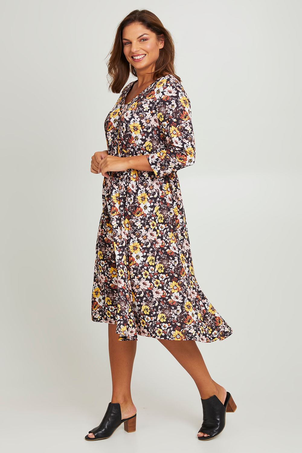 Model Monique wearing size 14 of the Jessie L/S Dress in colour Black (Black), from the front, showing the whole outfit