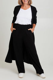 Model Sandy wearing size 10 of the Rachel Rib Duster in colour Black (Black), from the front, cropped image