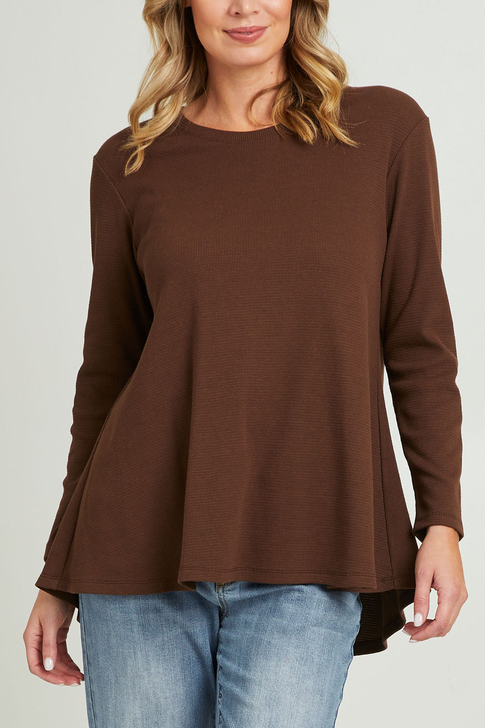 Model Grace wearing size 10 of the Swing Waffle Top in colour Espresso, from the front, cropped image
