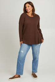 Model Monique wearing size 14 of the Swing Waffle Top in colour Espresso, from the front, showing the whole outfit