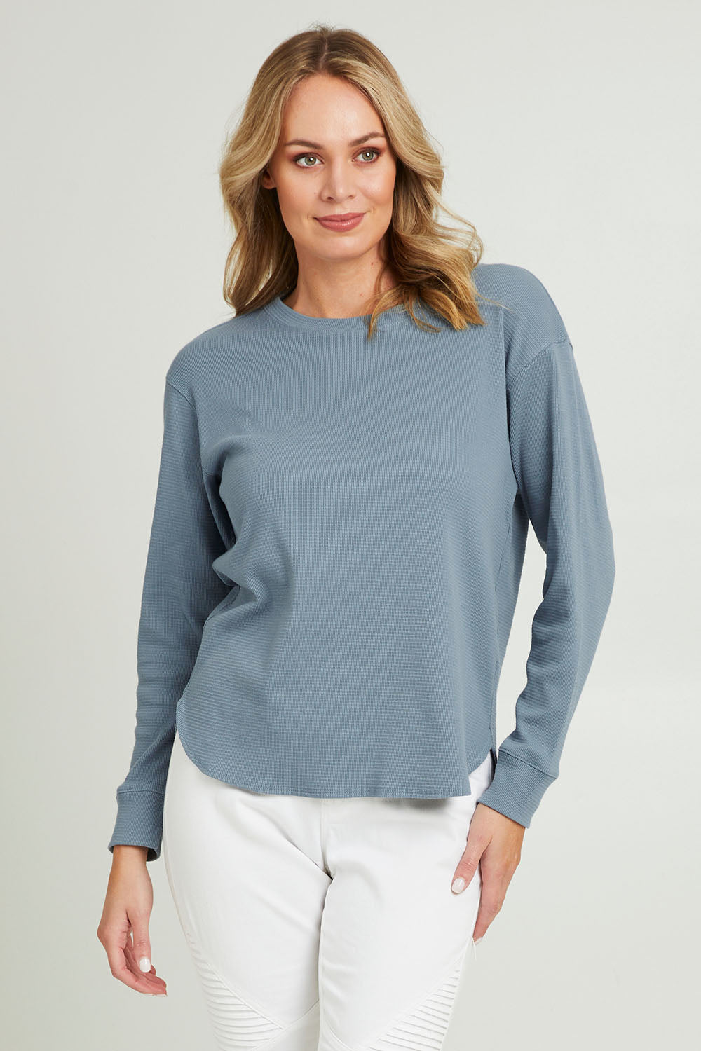 Model Grace wearing size 10 of the Waffle Weekend Crew in colour Ink (Blue), from the front, cropped image