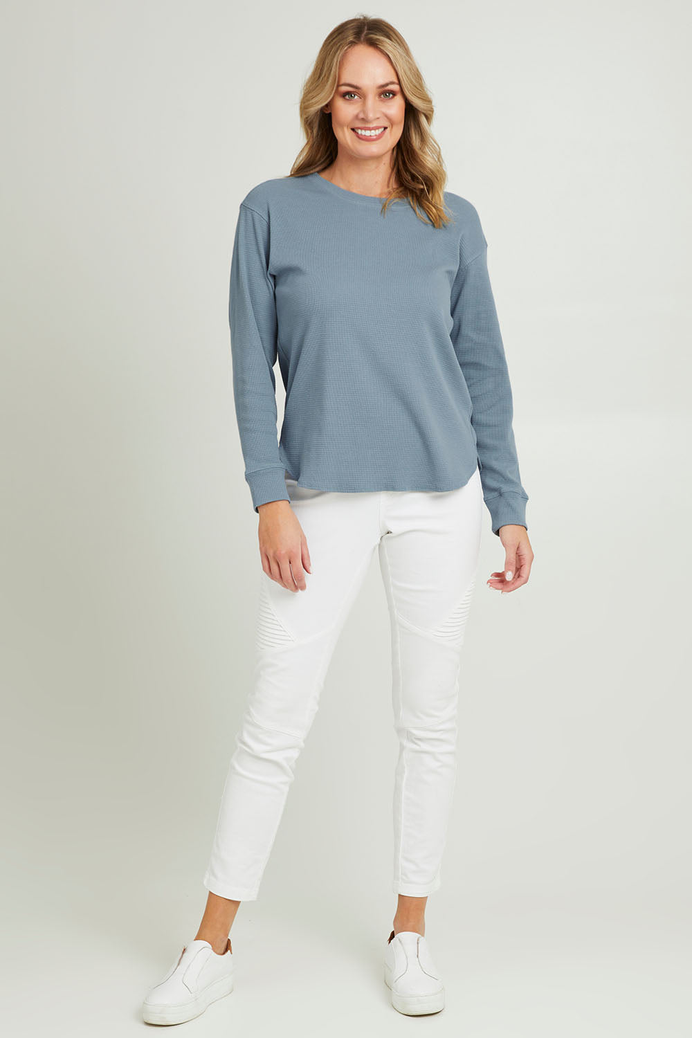 Model Grace wearing size 10 of the Waffle Weekend Crew in colour Ink (Blue), from the front, showing the whole outfit