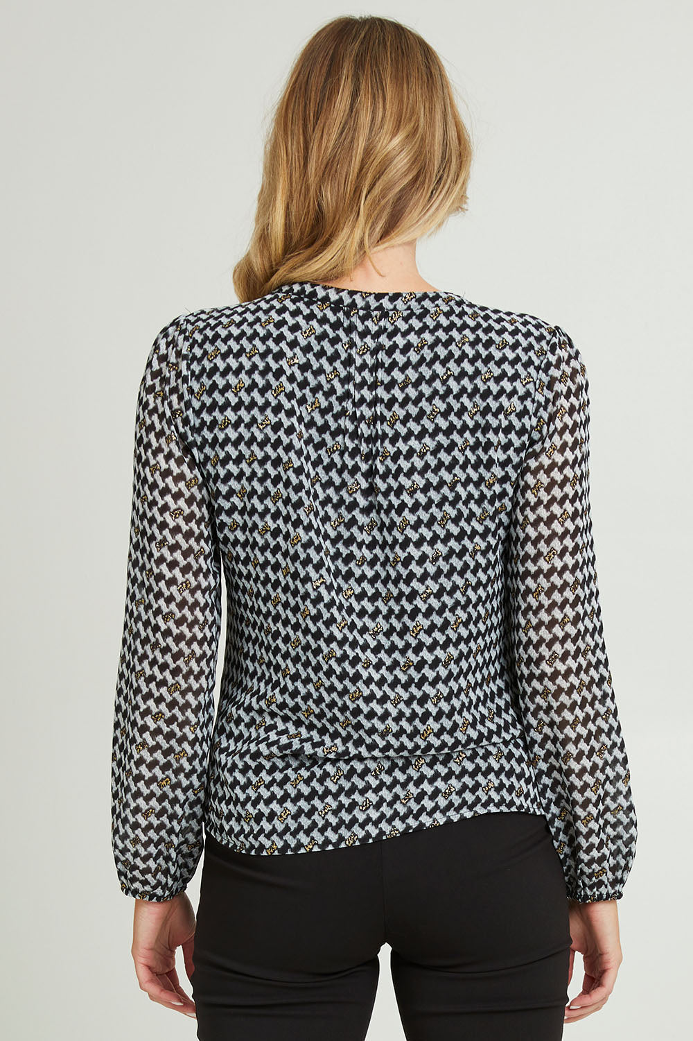 Model Grace wearing size 10 of the Chiffon Pintuck Top in colour Check (Black), from the back