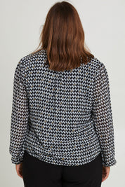 Model Monique wearing size 14 of the Chiffon Pintuck Top in colour Check (Black), from the back