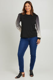 Model Monique wearing size 14 of the Contrast Pleat Top in colour Black (Black), from the front, showing the whole outfit