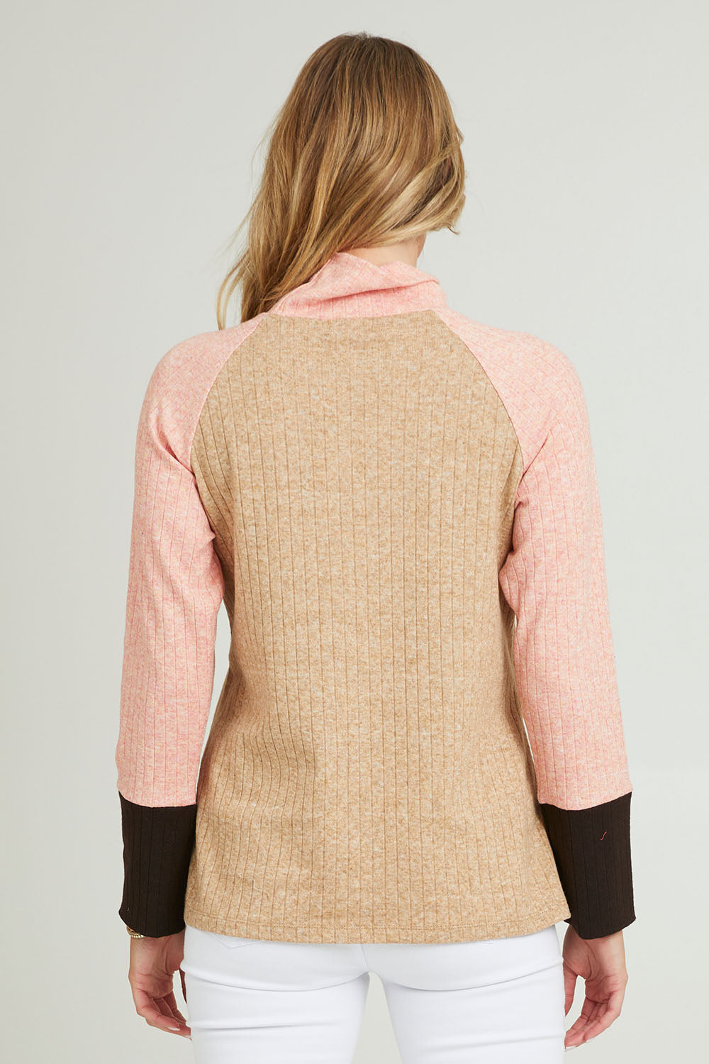 Model Grace wearing size 10 of the Spliced Cowl Rib Top in colour Coral, from the back