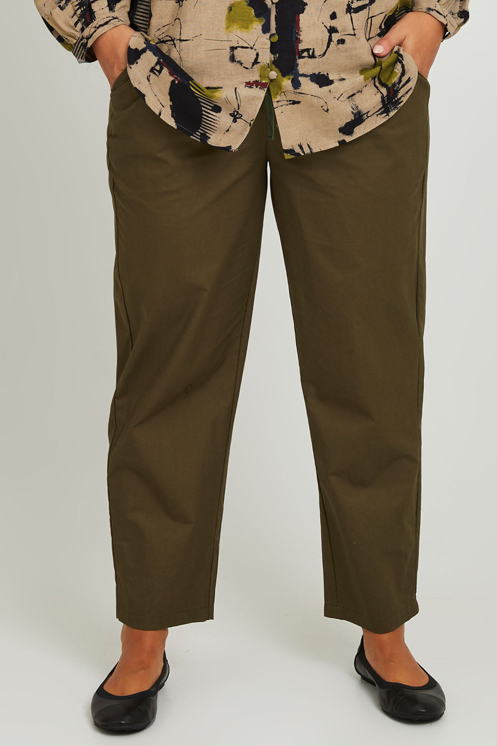 Model Monique wearing size 14 of the Cotton Cargo Pant in colour Khaki (Green), from the front, cropped image