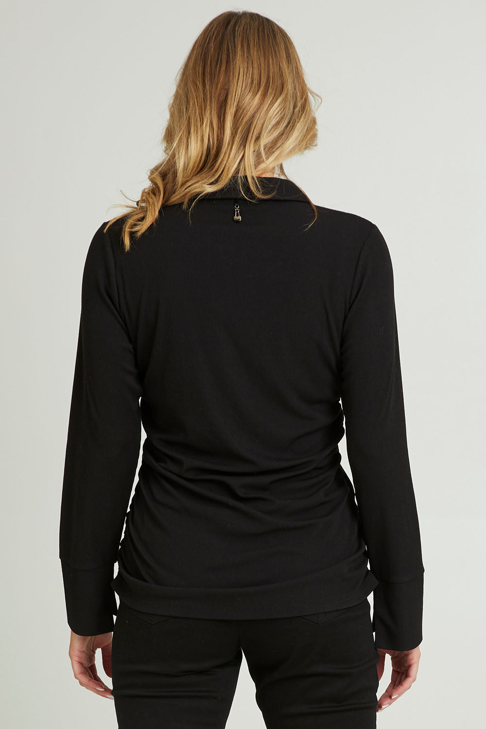 Model Grace wearing size 10 of the Ruched Sides Shirt in colour Black (Black), from the back