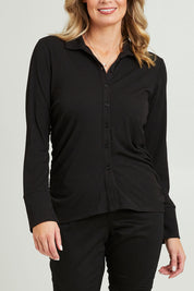 Model Grace wearing size 10 of the Ruched Sides Shirt in colour Black (Black), from the front, cropped image