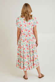 Model Grace wearing size 10 of the Tier Garden Dress in colour Mint (Green), from the back