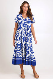 Model Madelinec wearing size 10 of the Tier Garden Dress – Blue in colour Blue, from the front