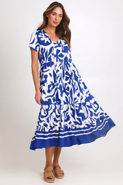 Model Madelinec wearing size 10 of the Tier Garden Dress – Blue in colour Blue, from the front
