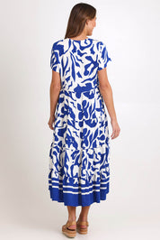 Model Madelinec wearing size 10 of the Tier Garden Dress – Blue in colour Blue, from the front