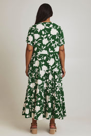 Model Ashleigh wearing size 16 of the Tier Garden Dress in colour Green (Green), from the back