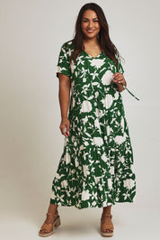 Model Ashleigh wearing size 16 of the Tier Garden Dress in colour Green (Green), from the front, showing the whole outfit