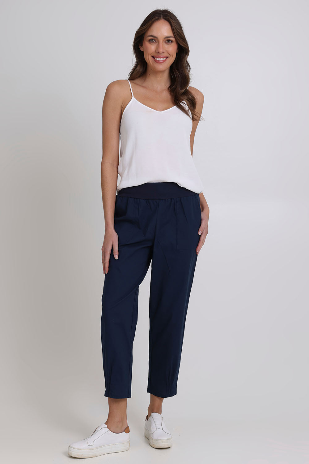 Model Madeline wearing size 10 of the Cotton Linen Comfort Pant in colour Navy (Blue), from the front, showing the whole outfit