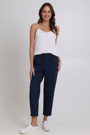 Model Madeline wearing size 10 of the Cotton Linen Comfort Pant in colour Navy (Blue), from the front, showing the whole outfit