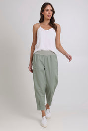 Model Madeline wearing size 10 of the Cotton Linen Comfort Pant in colour Sage (Green), from the front, showing the whole outfit