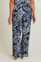 Model Sandy wearing size 10 of the Loose Fit Pant in colour Navywhite (Blue), from the back