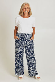 Model Sandy wearing size 10 of the Loose Fit Pant in colour Navywhite (Blue), from the front, showing the whole outfit