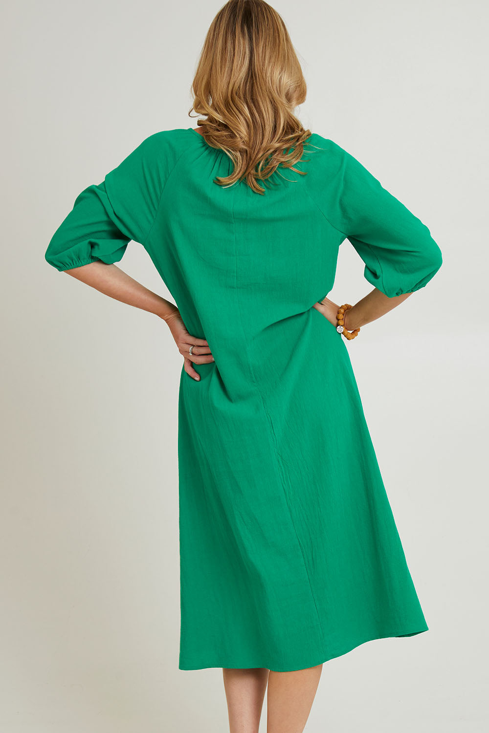 Model Grace wearing size 10 of the Pop Floral Core Cotton Upcycle Dress in colour Green (Green), from the back