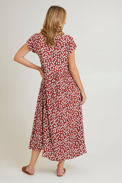 Model Grace wearing size 10 of the Teardrop Print Dress in colour Cinnamon, from the back