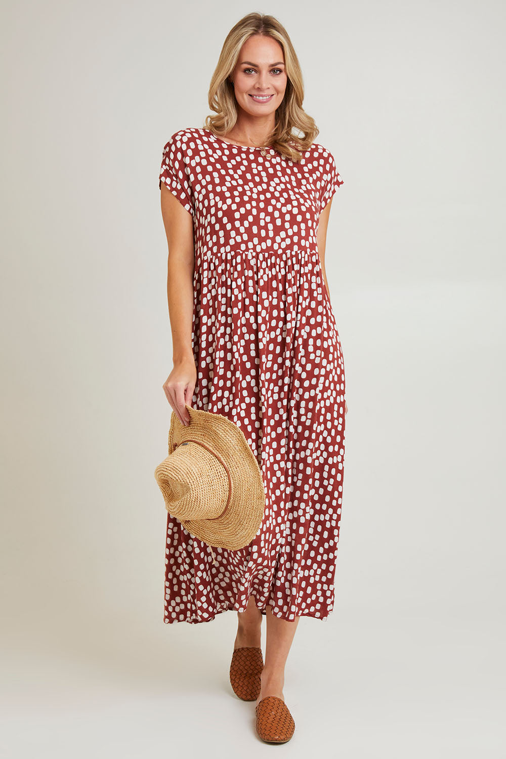 Model Grace wearing size 10 of the Teardrop Print Dress in colour Cinnamon, from the front, showing the whole outfit