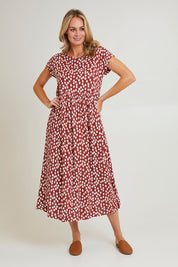 Model Grace wearing size 10 of the Teardrop Print Dress in colour Cinnamon, from the front, showing the whole outfit