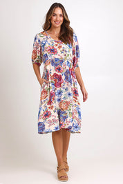 Model Madelinec wearing size 10 of the Billow Pocket Print Dress – Ivory in colour Ivory, from the front
