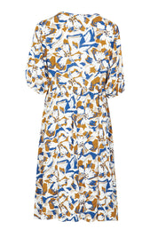 Product shot of the Billow Pocket Print Dress in colour Toffee (Blue), from the back