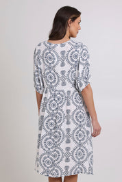 Model Madeline wearing size 10 of the Billow Pocket Print Dress in colour Whitenavy, from the back