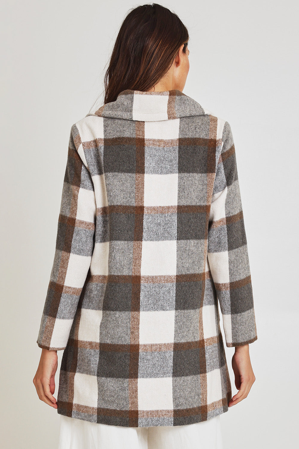 Model Madeline wearing size 10 of the Check Coat in colour Silver (Grey), from the back
