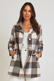 Model Madeline wearing size 10 of the Check Coat in colour Silver (Grey), from the front, cropped image