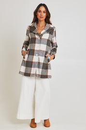 Model Madeline wearing size 10 of the Check Coat in colour Silver (Grey), from the front, showing the whole outfit
