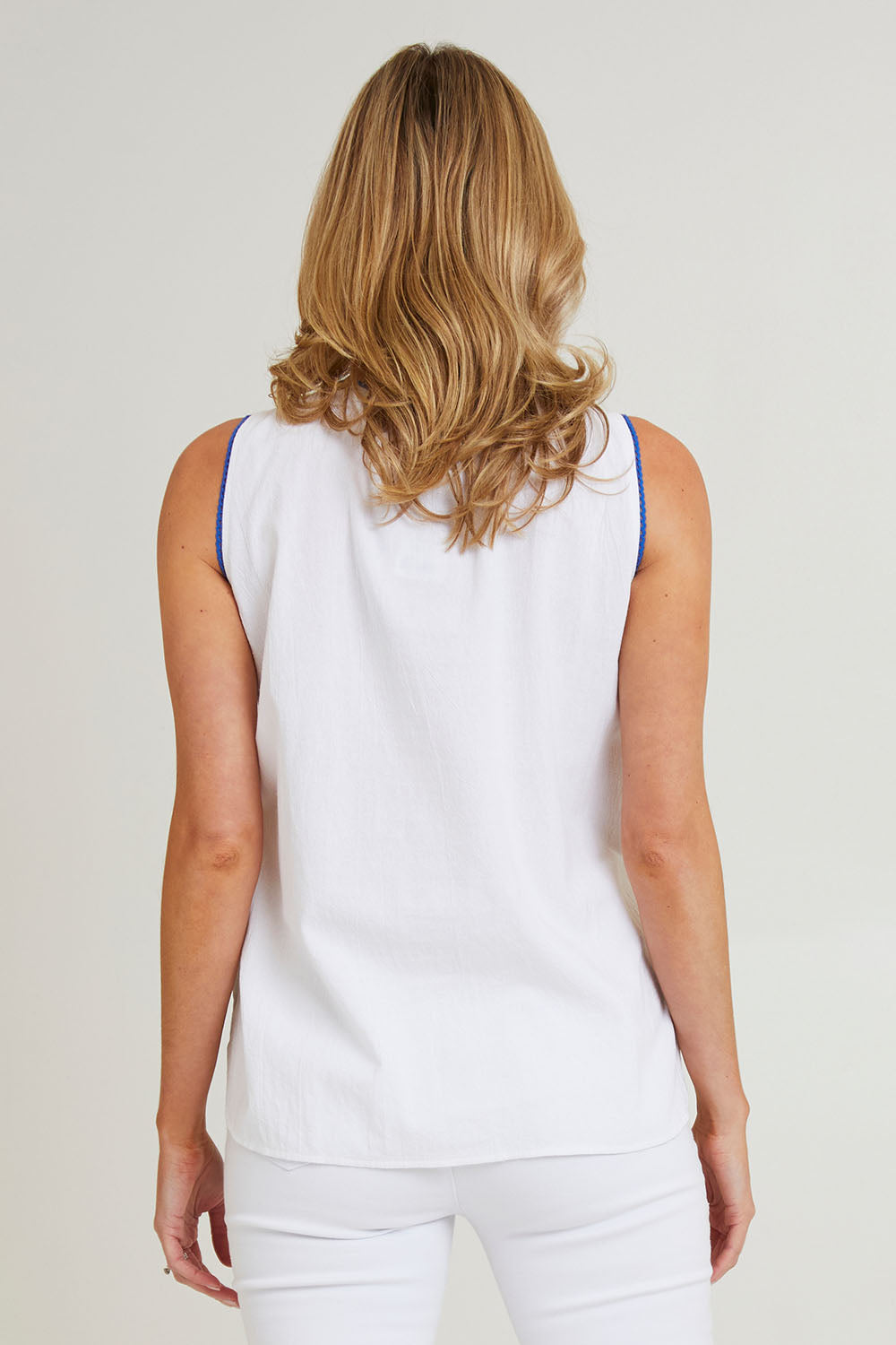 Model Grace wearing size 10 of the Hoi An Sleeveless Cotton Top in colour White (White), from the back