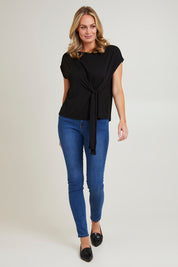 Model Grace wearing size 10 of the Bamboo Tye Top in colour Black (Black), from the front, showing the whole outfit