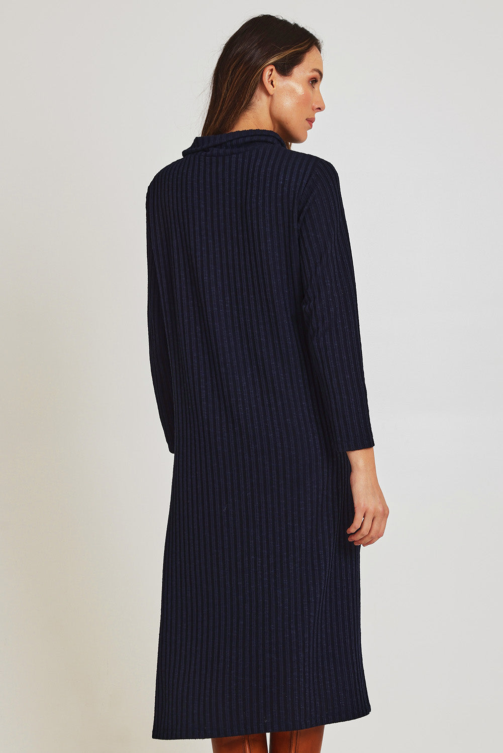 Model Madeline wearing size 10 of the Cowl Shift Dress in colour Navy (Blue), from the back