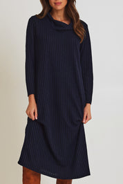 Model Madeline wearing size 10 of the Cowl Shift Dress in colour Navy (Blue), from the front, cropped image