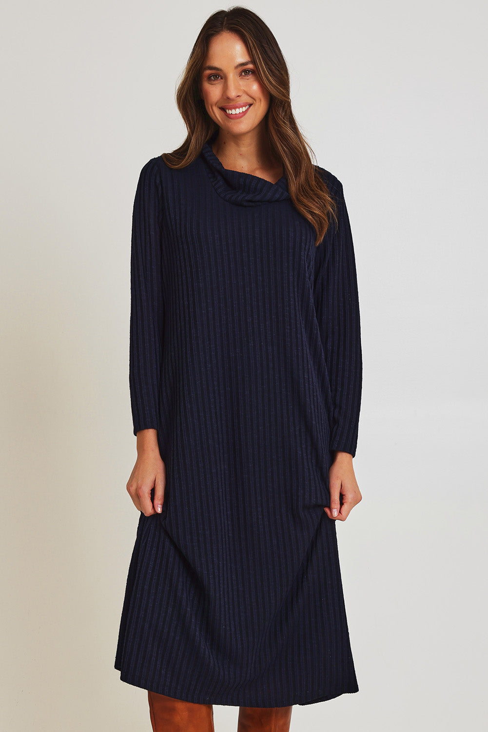 Model Madeline wearing size 10 of the Cowl Shift Dress in colour Navy (Blue), from the front, cropped image
