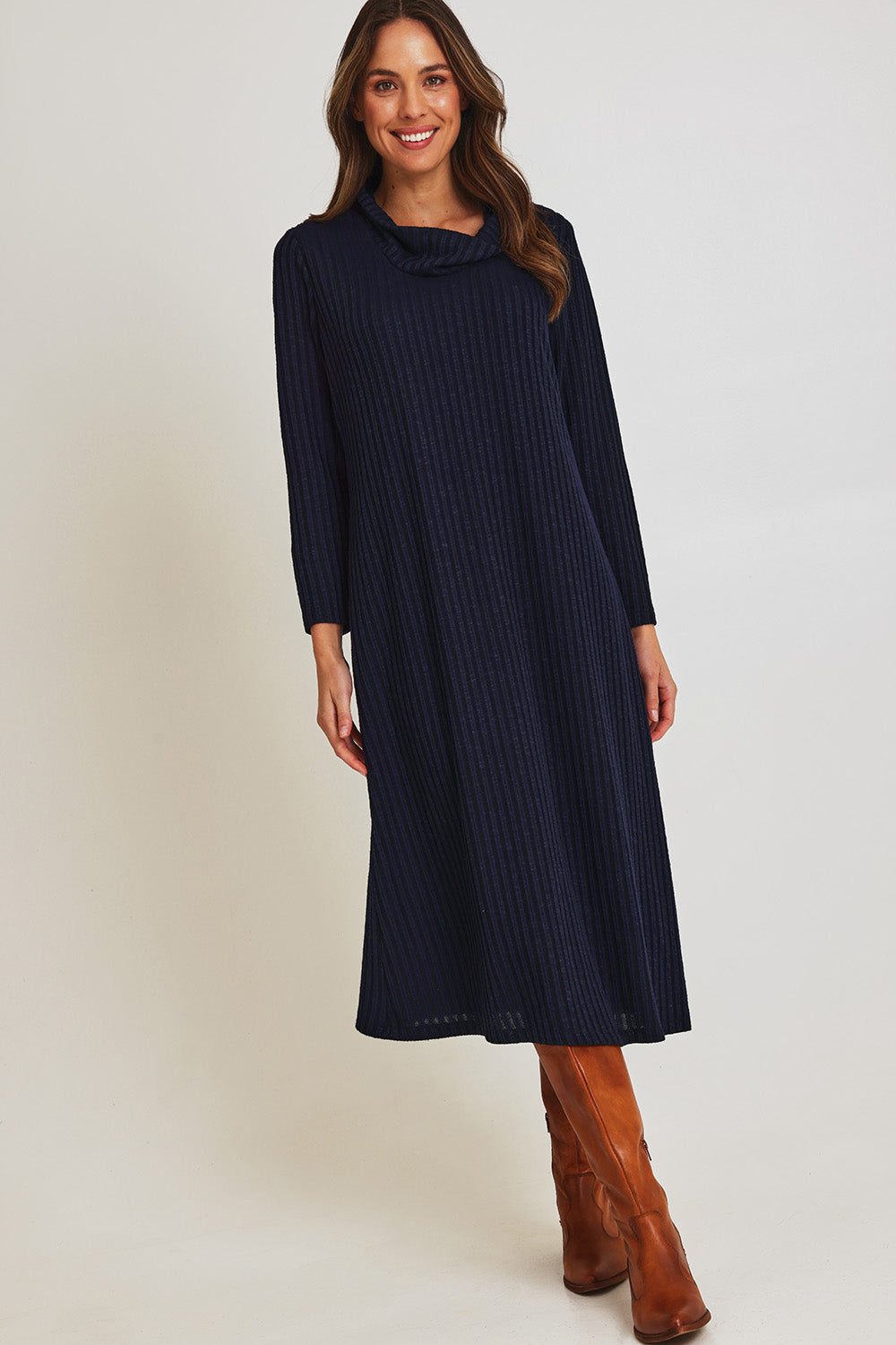 Model Madeline wearing size 10 of the Cowl Shift Dress in colour Navy (Blue), from the front, showing the whole outfit