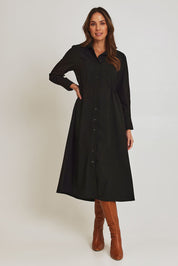 Model Madeline wearing size 10 of the Soft Fluid Dress in colour Black (Black), from the front, showing the whole outfit