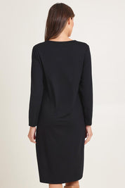 Model Madeline wearing size 10 of the Bamboo Dress in colour Black (Black), from the back